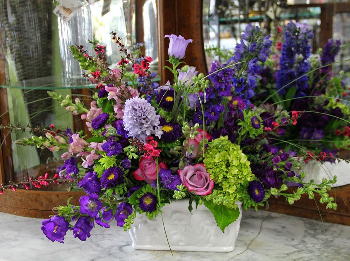 A wide range of colorful floral arrangements, awaiting their new home